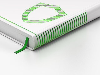 Image showing Security concept: closed book, Contoured Shield on white background