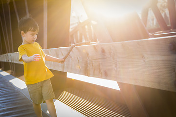 Image showing Handsome Mixed Race Boy Walking on Bridge