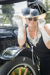Image showing Woman in Twenties Outfit Near Antique Automobile