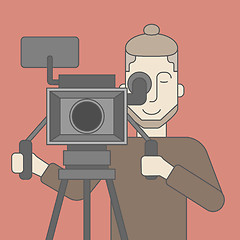 Image showing Cameraman with beard looking through movie camera