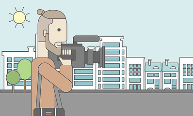 Image showing Cameraman with video camera