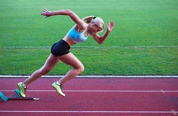 Image showing pixelated design of woman  sprinter leaving starting blocks