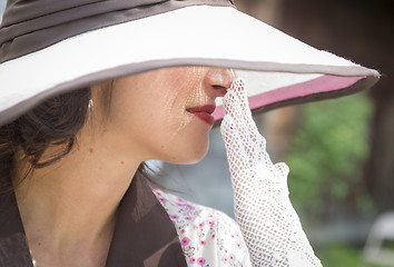 Image showing Pretty 1920s Era Dressed Girl With Hat and Gloves