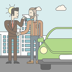 Image showing Car salesman giving the car keys to a new owner 