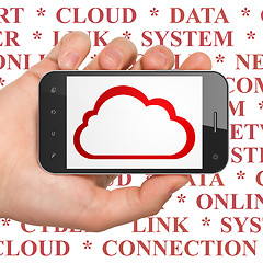 Image showing Cloud networking concept: Hand Holding Smartphone with Cloud on display