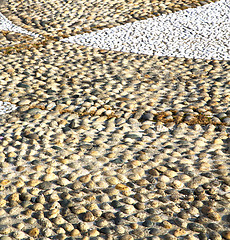 Image showing near parabiago street   italy      pavement of a curch and wall 