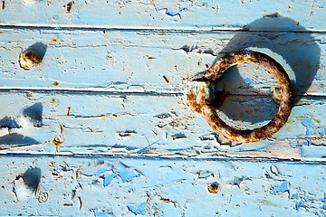 Image showing rusty metal      in the blue wood door and morocco  