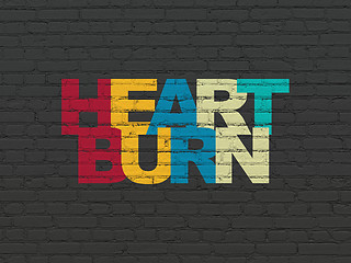 Image showing Health concept: Heartburn on wall background