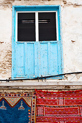 Image showing blue window in morocco  and brown   carpet