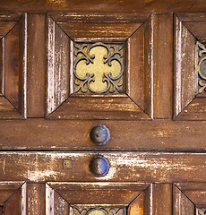 Image showing   knocker and wood  glass door caronno varesino varese italy