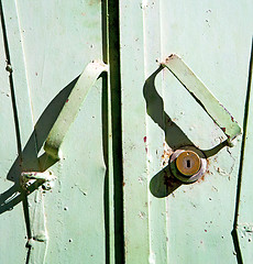 Image showing metal rusty  brown    morocco in africa the green  safe padlock 