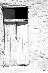 Image showing blue door in antique village santorini greece europe and white w