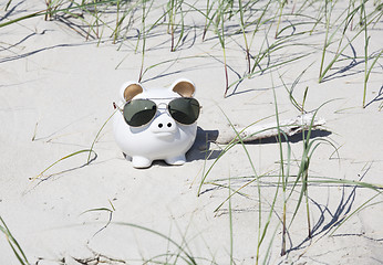 Image showing Piggy bank on the beach