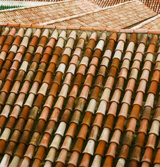 Image showing minaret old moroccan  tile roof in the old city 