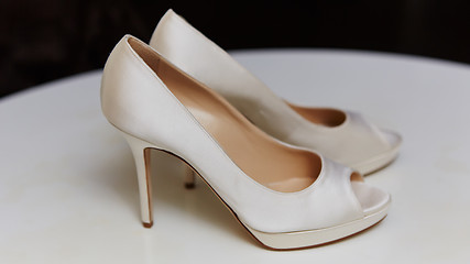 Image showing White wedding shoes for women.