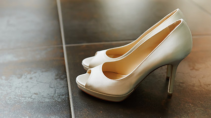 Image showing White wedding shoes for women.