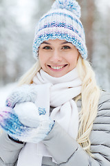 Image showing smiling young woman in winter forest