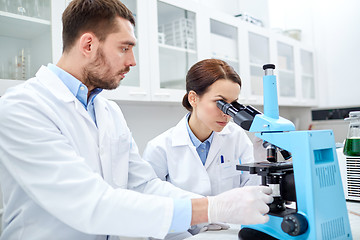 Image showing young scientists making test or research in lab