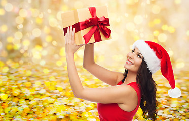 Image showing beautiful sexy woman in santa hat with gift box