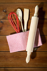 Image showing close up of kitchenware for baking on wooden board