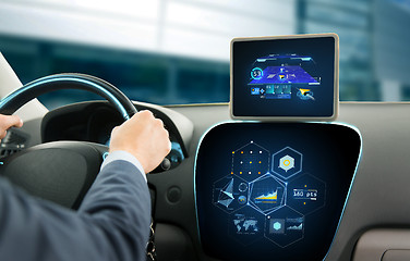 Image showing close up of man driving car with navigation system