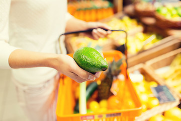 Image showing close up of woman with food basket in market