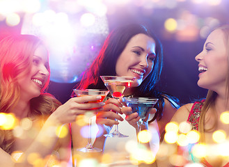 Image showing smiling women with cocktails at night club