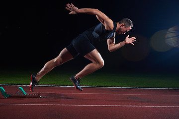 Image showing Sprinter leaving starting blocks