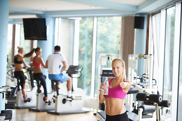 Image showing woman in fitness gym drink water