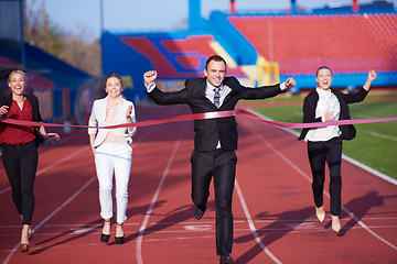 Image showing business people running on racing track