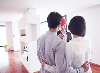 Image showing couple buying new home with real estate agent