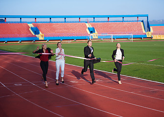 Image showing business people running on racing track