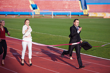 Image showing business people running on racing track