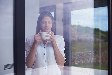Image showing beautiful young woman drink first morning coffee