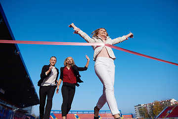 Image showing business people running on racing track