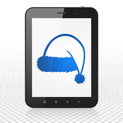 Image showing Holiday concept: Tablet Computer with Christmas Hat on display