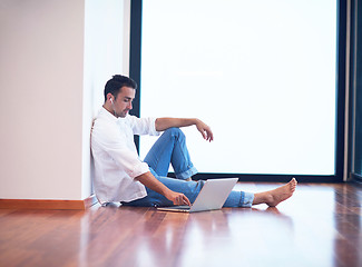 Image showing working on laptop computer from home