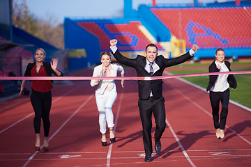 Image showing business people running on racing track