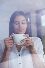 Image showing beautiful young woman drink first morning coffee