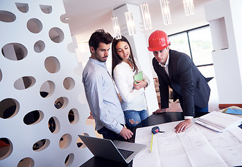 Image showing couple buying new home with real estate agent