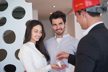 Image showing couple buying new home with real estate agent