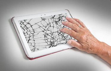 Image showing Senior lady with tablet, cracked screen