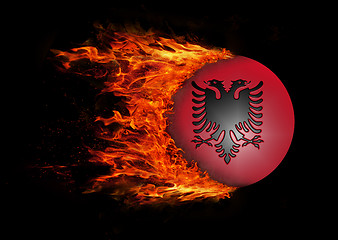 Image showing Flag with a trail of fire - Albania