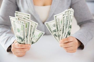 Image showing close up of woman hands holding us dollar money