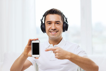 Image showing happy man with smartphone and headphones