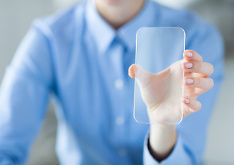 Image showing close up of woman with transparent smartphone