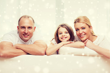 Image showing smiling parents and little girl at home