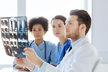 Image showing group of doctors looking to x-ray at hospital