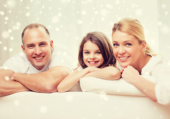 Image showing smiling parents and little girl at home