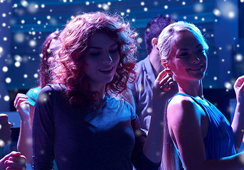 Image showing group of happy friends dancing in night club